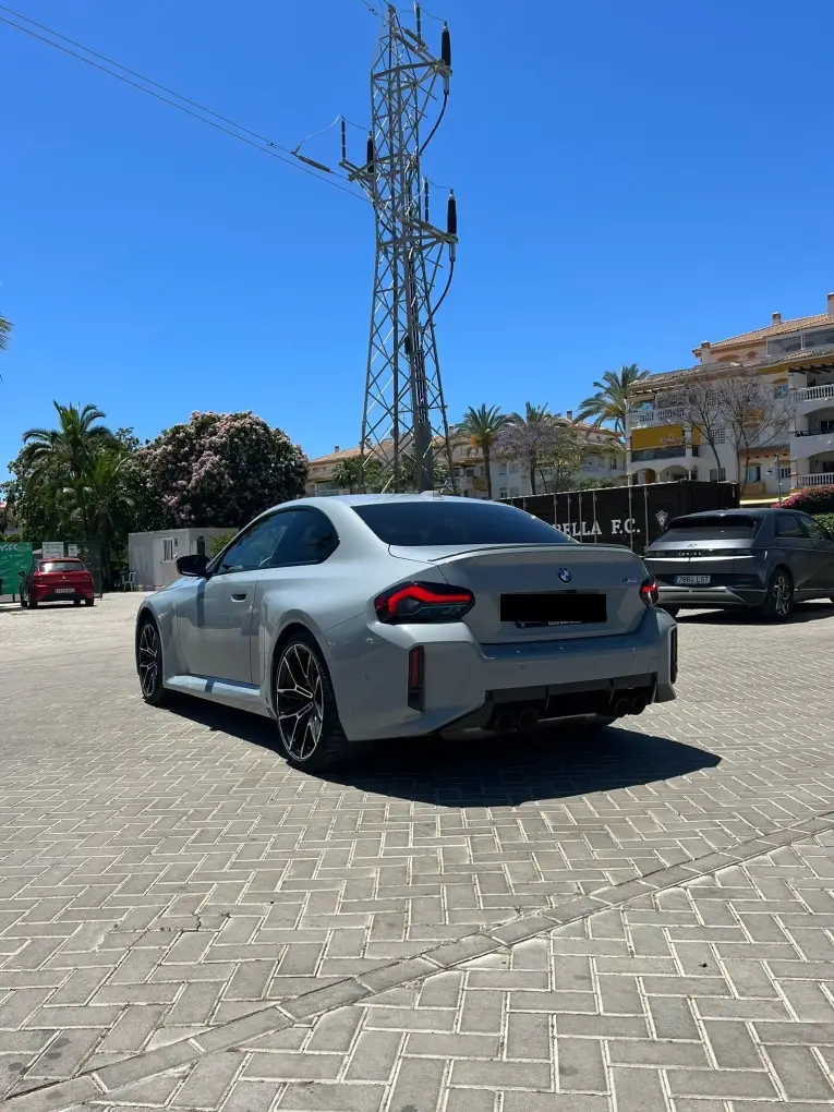 BMW M2 2024, exterior — Ibiza Luxury Car Rental, Ibiza. BMW M2 in Ibiza A BMW M2 rental in Ibiza combines 460 horsepower with a dedicated sport…