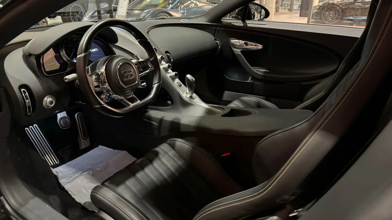 Bugatti Chiron 110 Ani 2019, interior — Ibiza Luxury Car Rental, Ibiza. Bugatti Chiron 110 Ani in Ibiza A Bugatti Chiron 110 Ani rental in Ibiza delivers 1500…